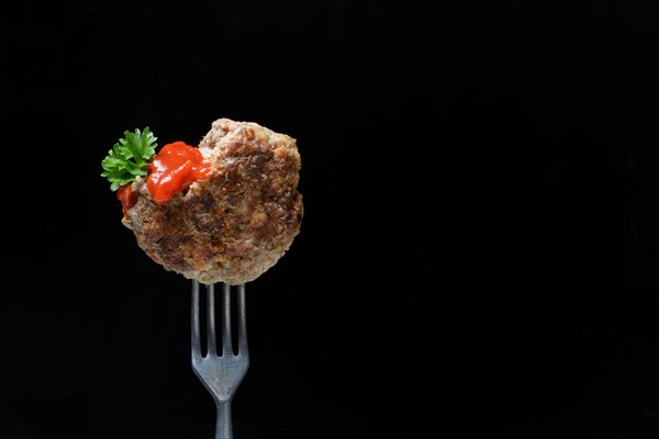 Homemade meatball on fork