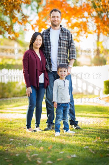 Outdoor portrait of multiethnic chinese and caucasian family