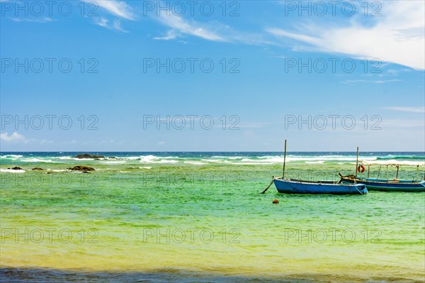 Boats on the waters of the paradisiacal beach of Itapua in the city of Salvador in Bahia