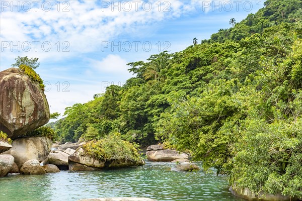 Salt water lagoon between the rocks and the preserved tropical forest in Trindade on the south coast of the state of Rio de Janeiro