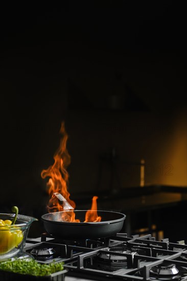 Open and controlled fire in a frying pan