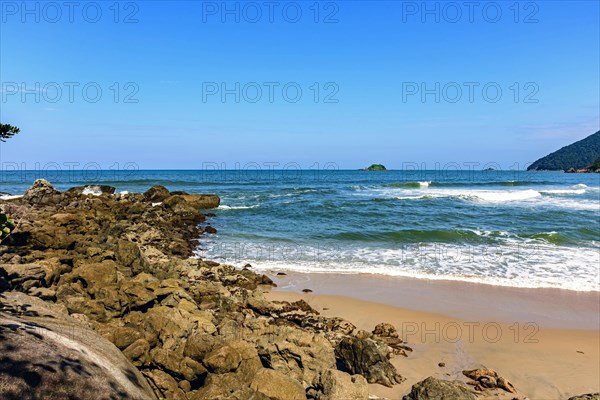 Paradisiacal rocky beach with clean and calm waters in Bertioga coastal state of Sao Paulo
