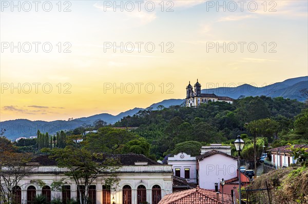 Old church on top of the hill with the city of Ouro Preto