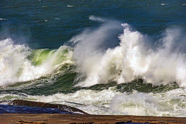 Big waves crashing on the beaches of Rio de Janeiro during a tropical storm in summer