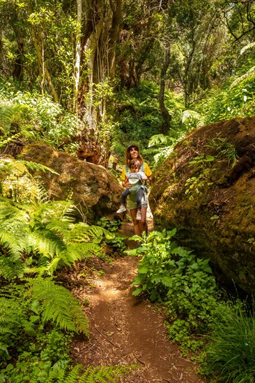 A young woman trekking on a path in La Llania on El Hierro