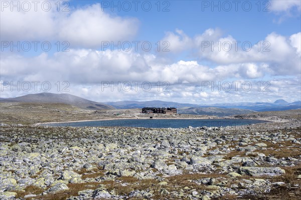 Snoheim mountain hut by a mountain lake