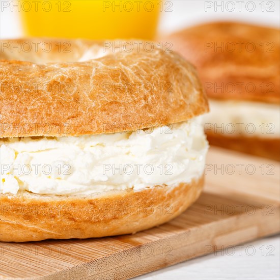 Bagel sandwich for breakfast topped with cream cheese close-up square in Stuttgart