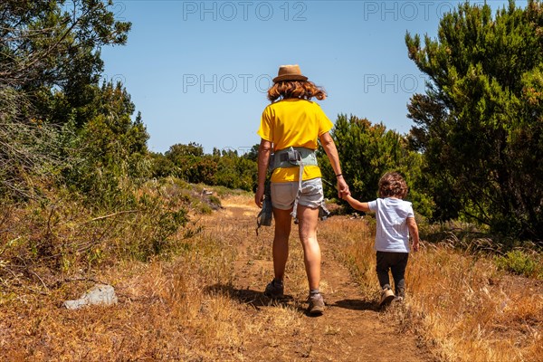 A mother with her son on a hiking trail in La Llania on El Hierro