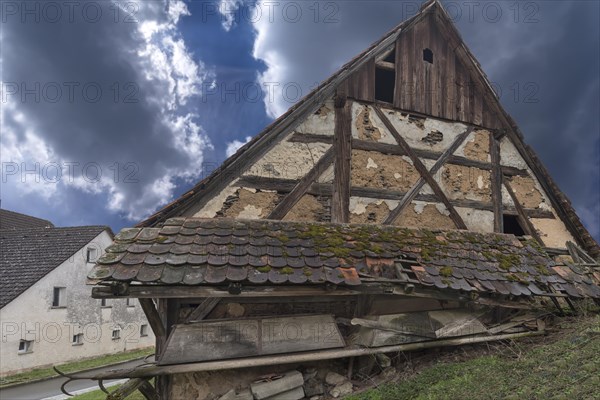 Dilapidated half-timbered building of a farm