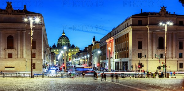 Street scene on Via della Conciliazione to St. Peter's Basilica in the evening light