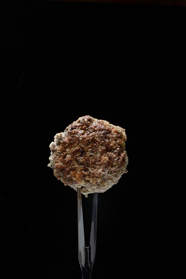 Homemade meatball on fork