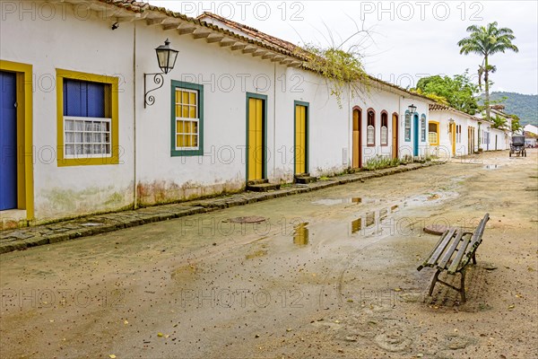 Sand street and old houses in colonial style on the streets of the old and historic city of Paraty founded in the 17th century on the coast of the state of Rio de Janeiro