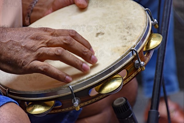 Tambourine being played by a ritimist during a samba performance in Rio de Janeiro