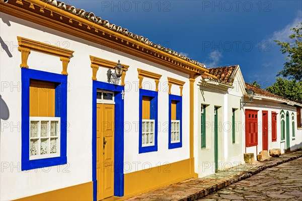 Cobblestone street with old colonial style houses in the city of Tiradentes