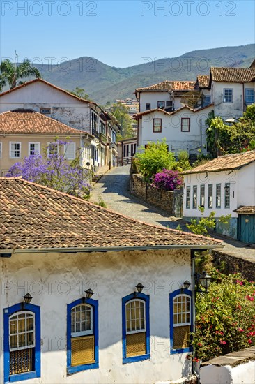Quiet street with old colorful houses in colonial architecture