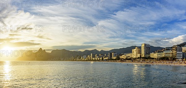 Panoramic image of Ipanema beach during sunset with the sea