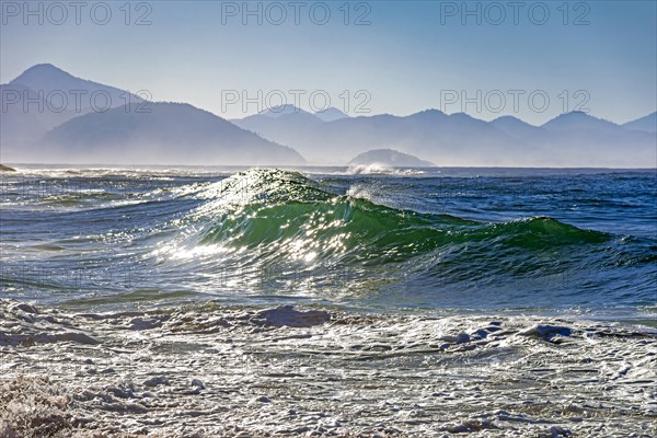 Waves crashing against the beach at dawn in Ipanema in Rio de Janeiro city