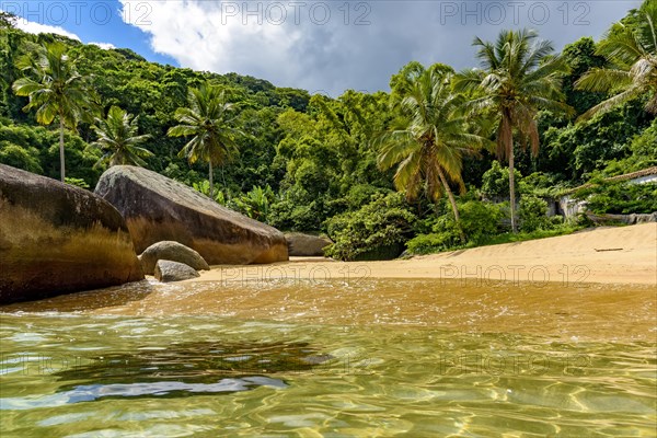 Beautiful deserted and unspoilt beach surrounded by rainforest on Ilha Grande