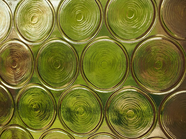 Greenery seen through decorated glass useful as a background