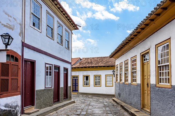 Street with cobblestones and houses with colonial architecture in the old and historic city of Diamantina in Minas Gerais