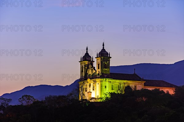 Night view of the historic 18th century church and hills at Ouro Preto city