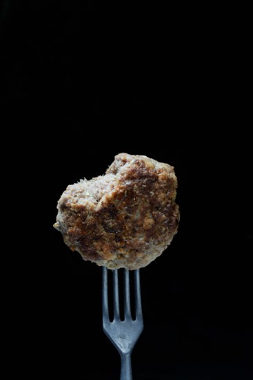 Homemade meatball on fork