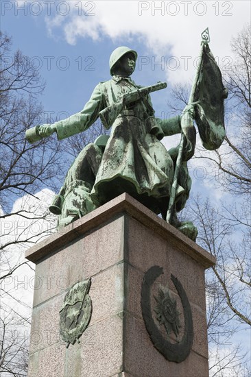 Soviet soldier with weapon and flag