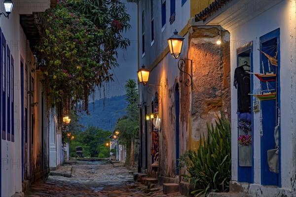 Bucolic street in the city of Paraty in the state of Rio de Janeiro with its colonial-style houses and cobblestones at dusk.