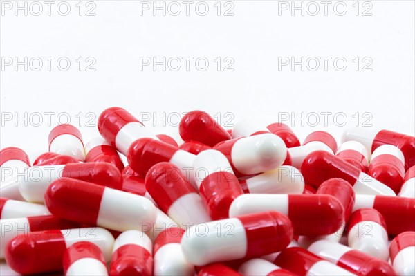 Various medicine pills on white background with free space