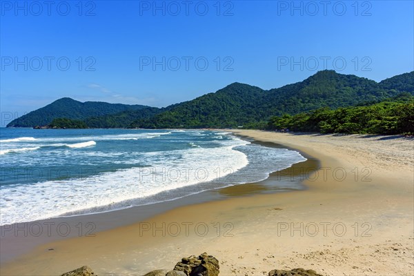 Beach in Bertioga on the north coast of the state of Sao Paulo surrounded by untouched forest and mountains