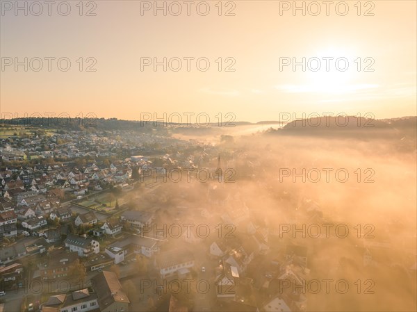 City in the fog at sunrise