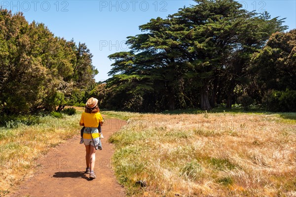 A mother with her son enjoying on the La Llania trekking trail in El Hierro