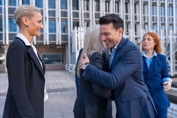 Successful Business Executives Congratulating Each Other in Corporate District