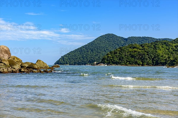 The sea with calm and transparent waters between the rocks