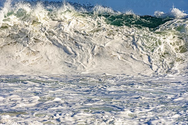 Strong wave and sea foam at Ipanema beach in Rio de Janeiro on a sunny day