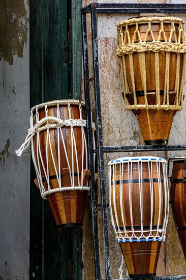 Atabaques displayed for sale in a musical instrument shop in Salvador in Bahia