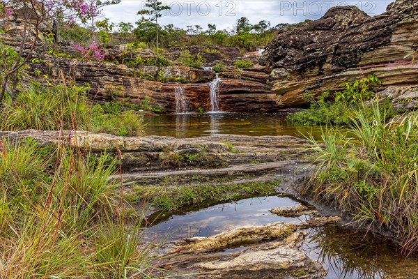Beautiful and small cascade among the rocks and vegetation of the Biribiri environmental reserve in Diamantina