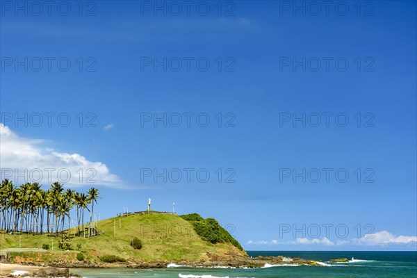 Seafront of the city of Salvador in Bahia with coconut trees and clear waters on a beautiful tropical sunny day.