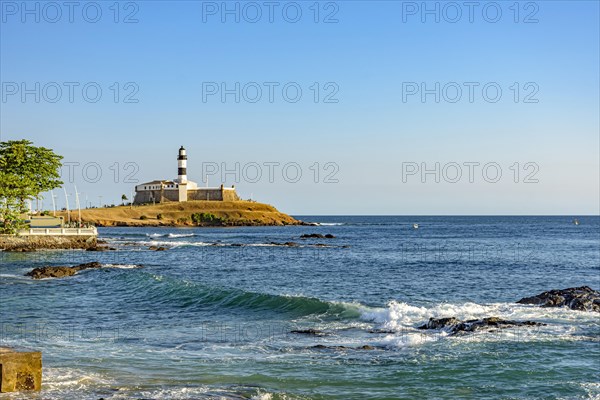 View of the famous lighthouse in the all saints bay in the city of Salvador