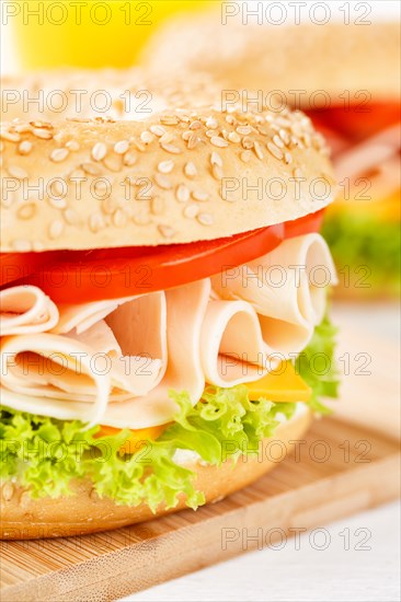 Bagel sandwich for breakfast topped with chicken ham close-up in Stuttgart