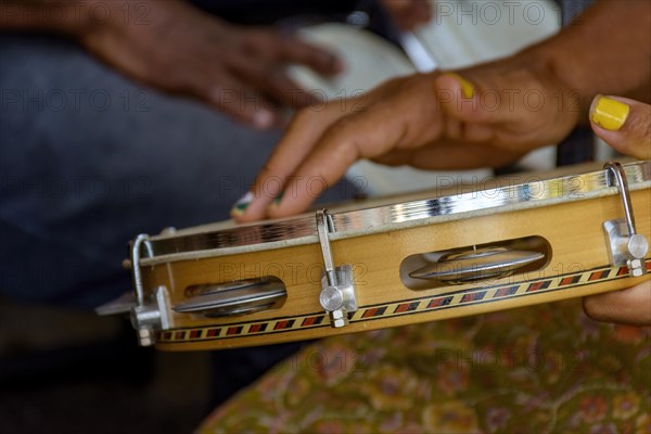 Tambourine being played by a ritimist during a samba performance in brazilian carnival in Rio de Janeiro