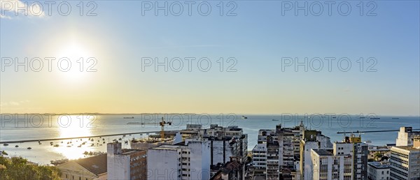 Buildings and port of the city of Salvador with the bay of All Saints in the background during sunset in Bahia state