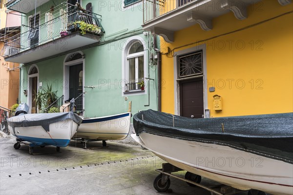 Boats parked in the street at Manarola