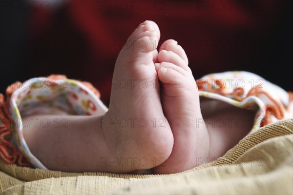 Close-up of two baby feet of a newborn child