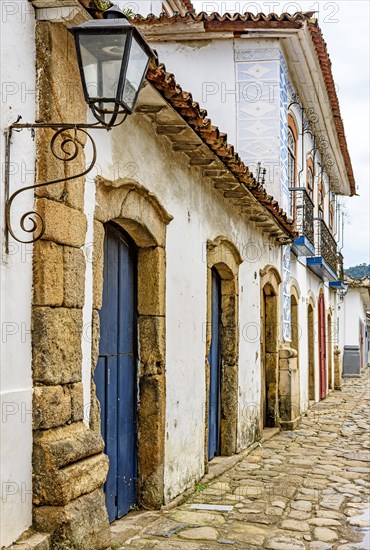 Details of the houses and their colonial architecture in the historic streets with cobblestones in the city of Paraty