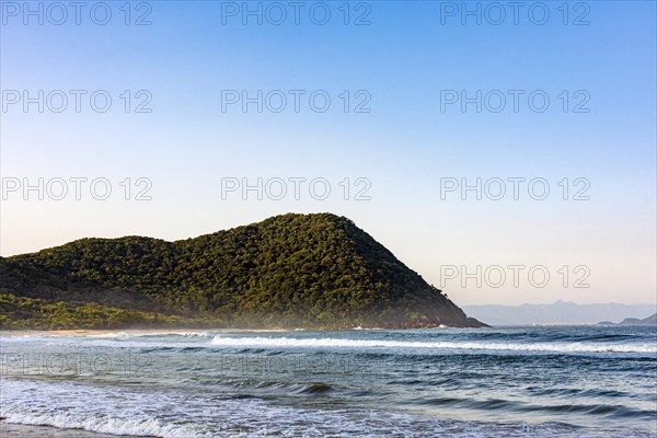 Paradise beach surrounded by rainforest in coastal Bertioga of Sao Paulo state