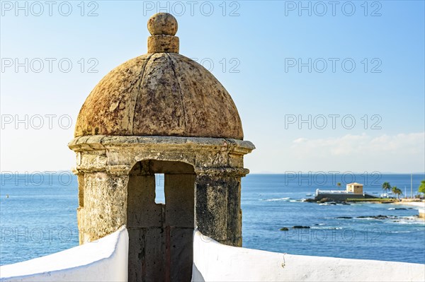 Stone guardhouse on the walls of an old colonial-style fort on the seafront of Salvado in Bahia