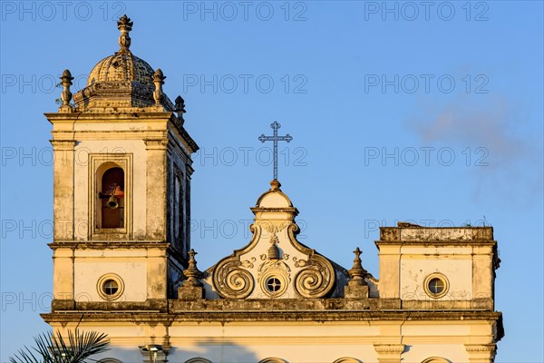 Details of historic bell tower and facade of old baroque church in Pelourinho district in Salvador city in Bahia at evening