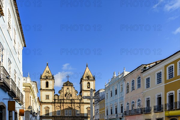 Facades of old and historic church and houses in colonial and baroque style in the tourist center of Pelourinho