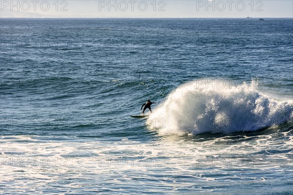 Surfer silhouette on Ipanema beach